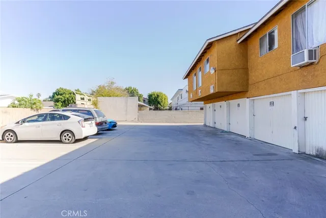 a view of a car in front of a building
