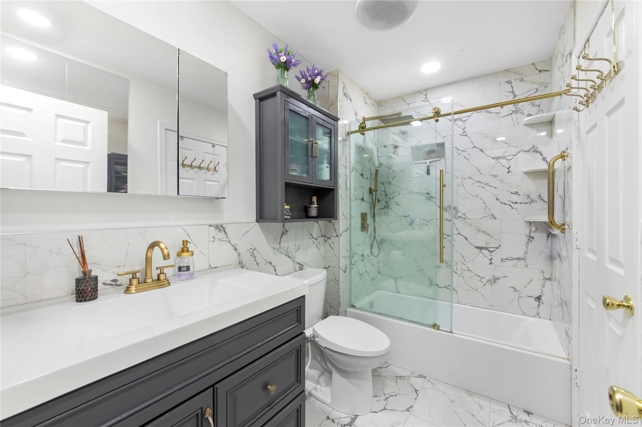 79 Creekside Circle Spring Valley, NY 10977 - Photo 11 of 13 a bathroom with a sink a toilet and shower