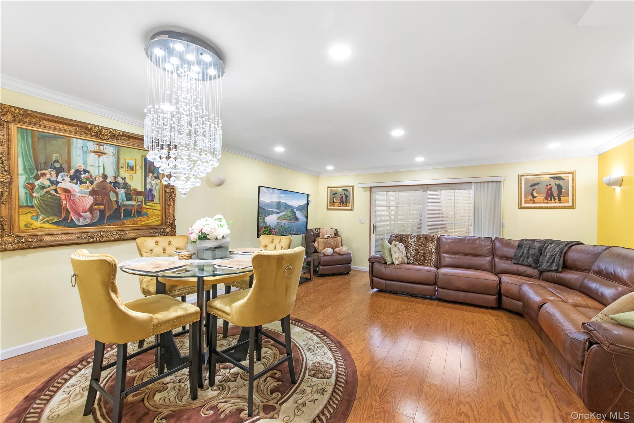 79 Creekside Circle Spring Valley, NY 10977 - Photo 4 of 13 a living room with furniture a chandelier and wooden floor
