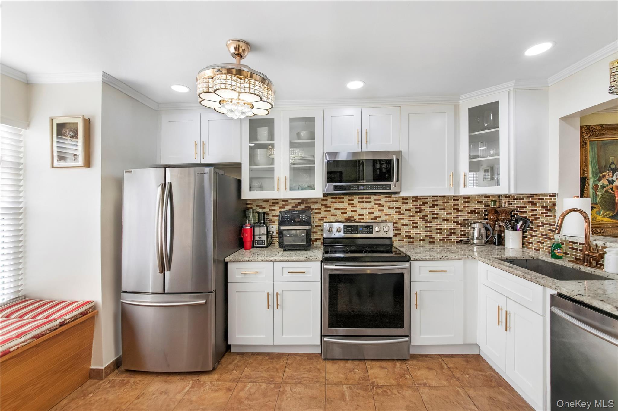 79 Creekside Circle Spring Valley, NY 10977 - Photo 6 of 13 a kitchen with stainless steel appliances a refrigerator stove a sink dishwasher and microwave