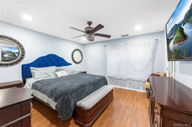 a bed sitting in a room next to a window