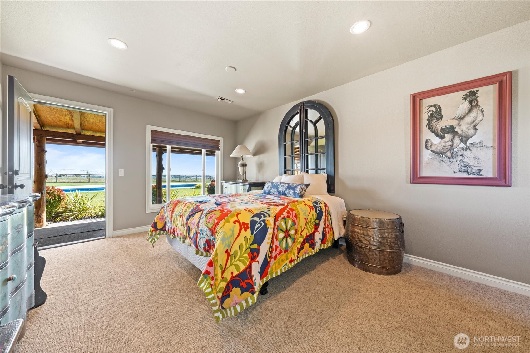 8708 Rd K Northeast Moses Lake, WA 98837 - Photo 14 of 40 a bedroom with a bed and a painting on the wall