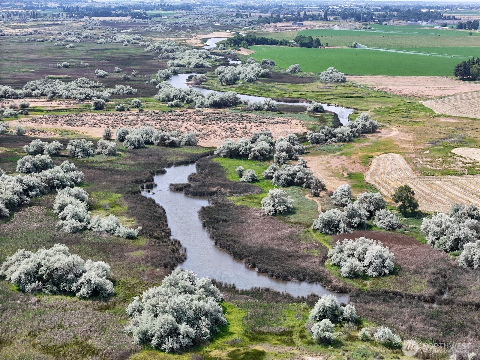 8708 Rd K Northeast Moses Lake, WA 98837 - Photo 31 of 40 a view of a lake with beach and outdoor space