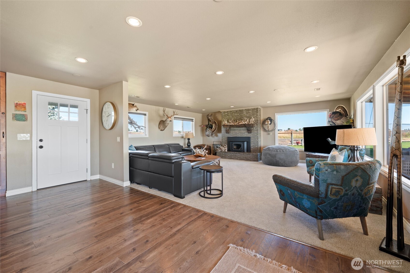 8708 Rd K Northeast Moses Lake, WA 98837 - Photo 8 of 40 a living room with furniture a flat screen tv and kitchen view