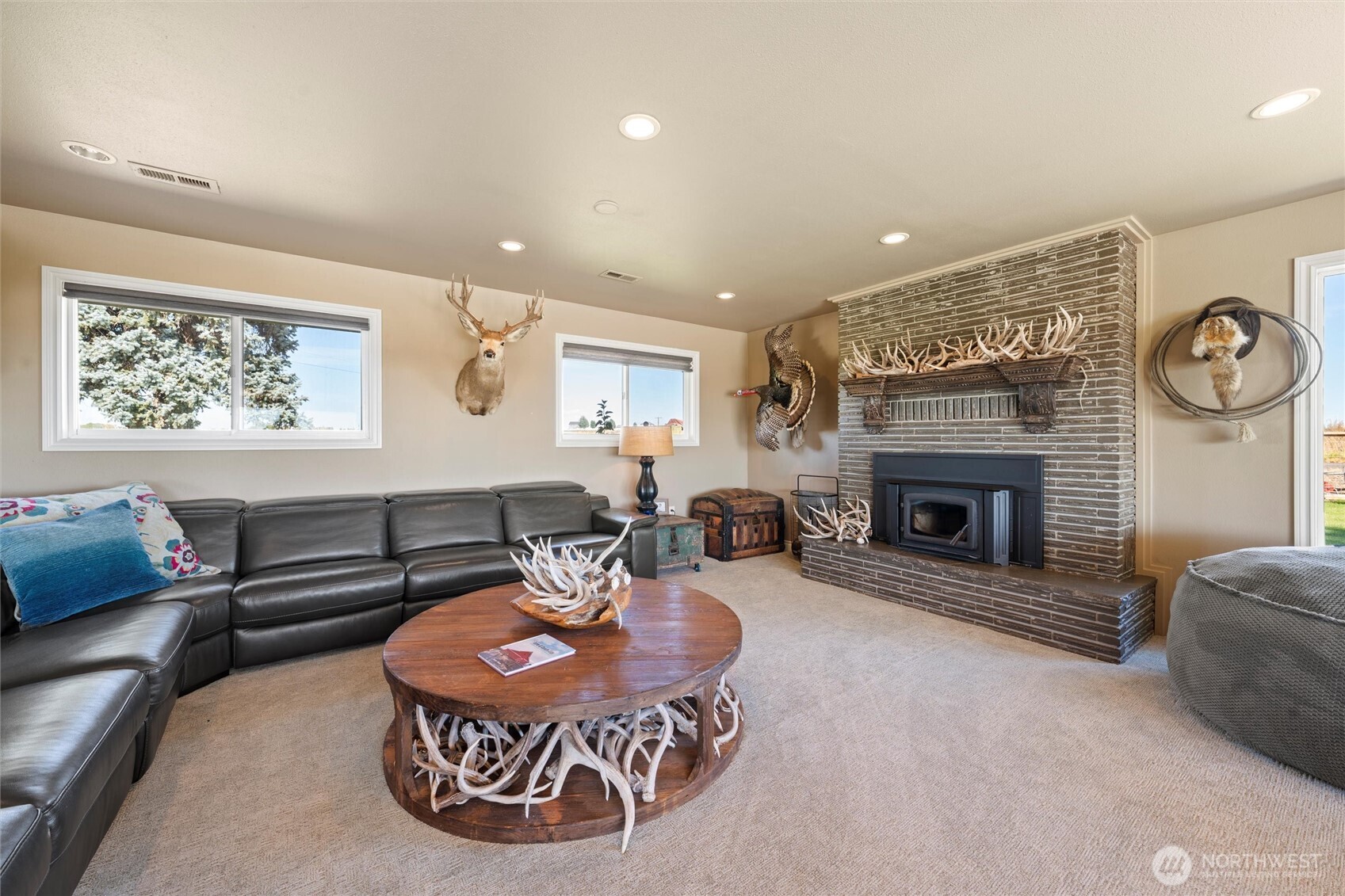 8708 Rd K Northeast Moses Lake, WA 98837 - Photo 9 of 40 a living room with furniture a fireplace and window