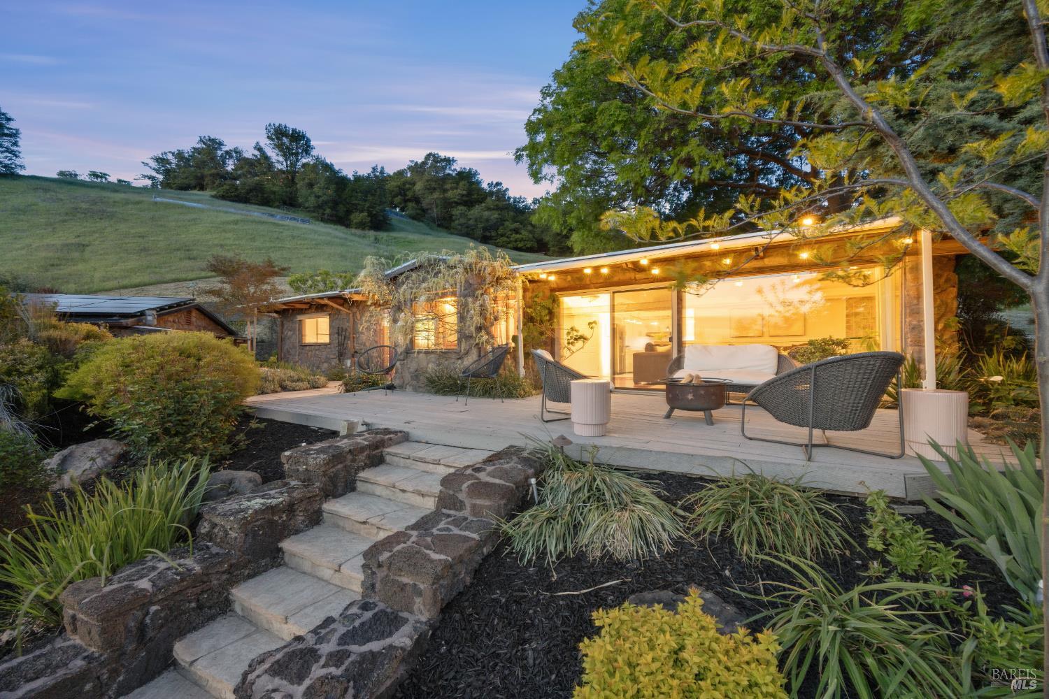 6960 Round Oak Road Penngrove, CA 94951 - Photo 2 of 58 a view of a swimming pool with lawn chairs under an umbrella