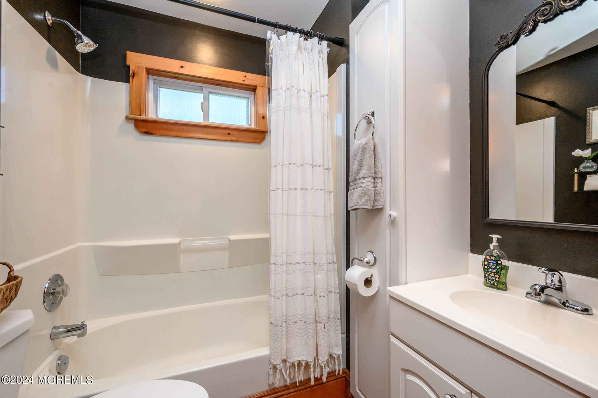 13 Oliver Street Toms River, NJ 08755 - Photo 18 of 41 a bathroom with a tub shower sink and vanity