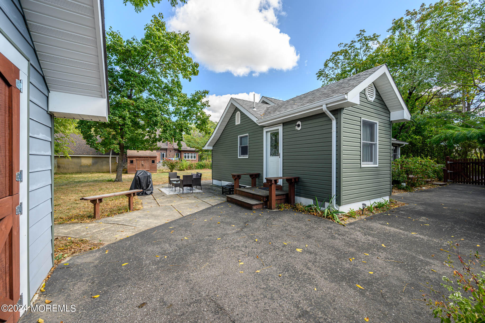 13 Oliver Street Toms River, NJ 08755 - Photo 29 of 41 a view of backyard with a table and chairs and a large tree