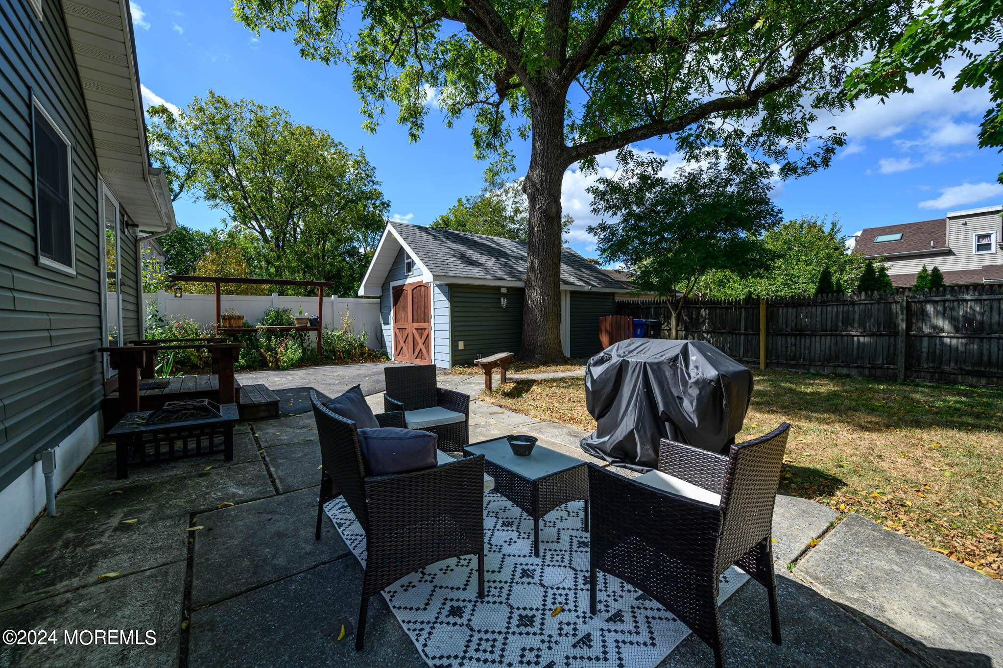 13 Oliver Street Toms River, NJ 08755 - Photo 33 of 41 a view of backyard of house with seating space