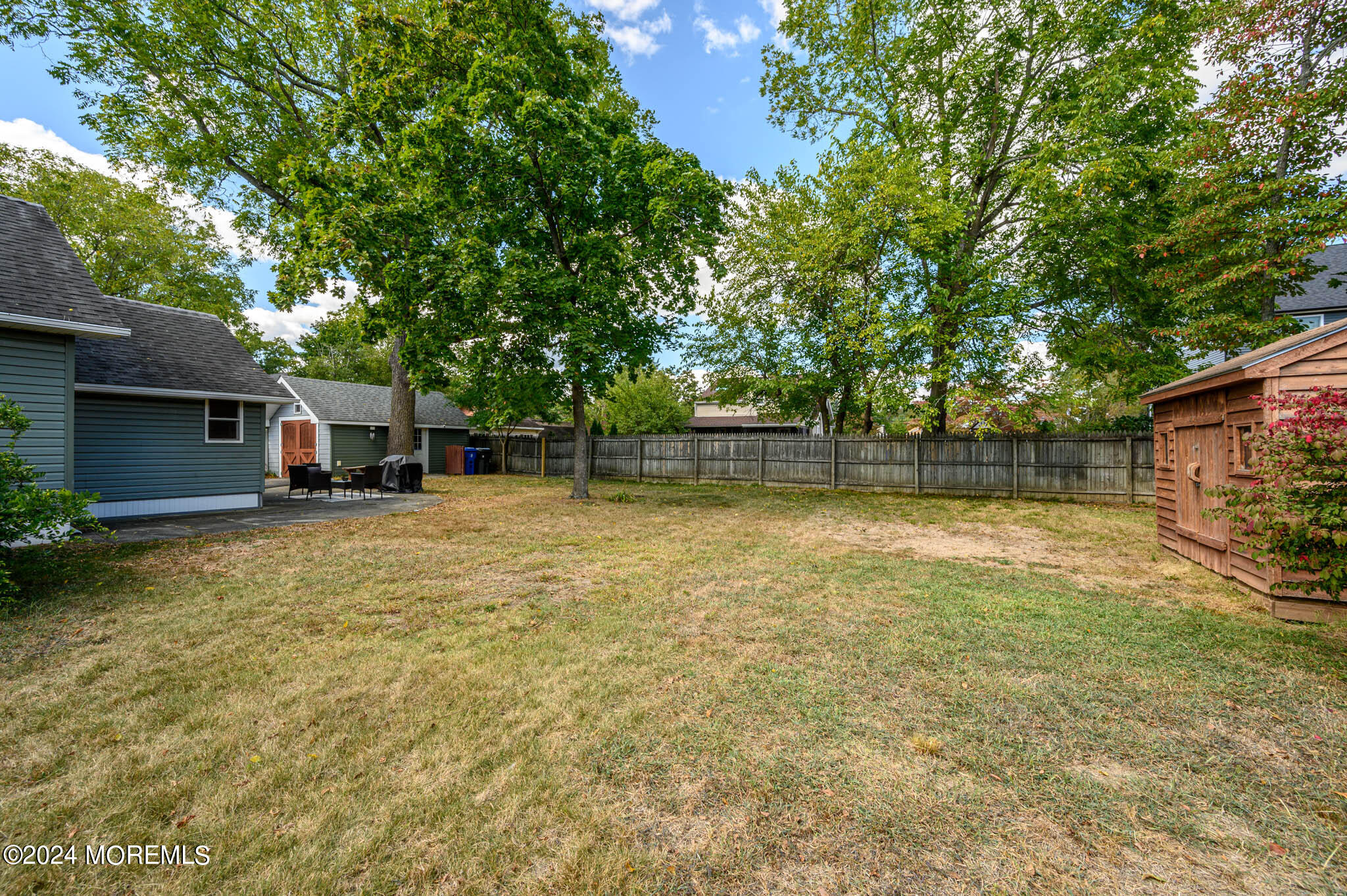 13 Oliver Street Toms River, NJ 08755 - Photo 36 of 41 a backyard of a house with table and chairs