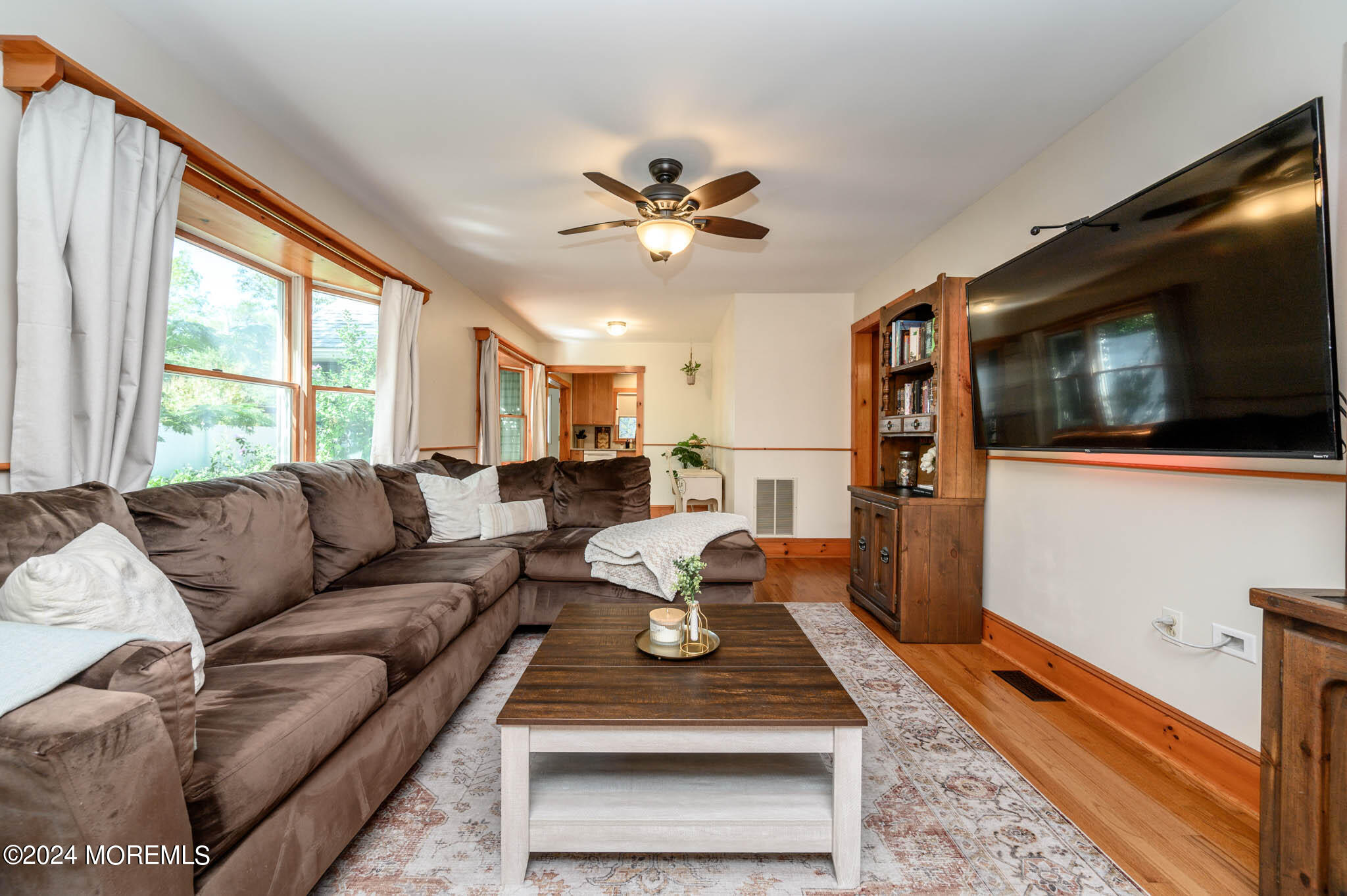 13 Oliver Street Toms River, NJ 08755 - Photo 6 of 41 a living room with furniture a flat screen tv and a window