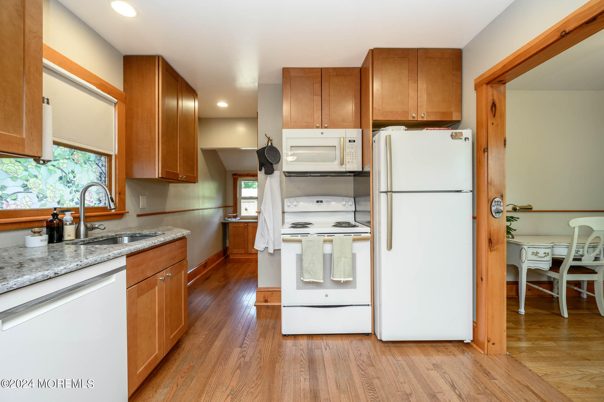 13 Oliver Street Toms River, NJ 08755 - Photo 10 of 41 a kitchen with a refrigerator a stove and wooden floor
