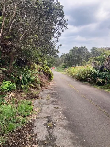 a view of a road with an ocean view
