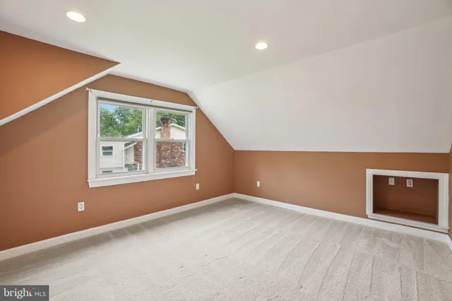 a bathroom with a sink vanity granite and toilet