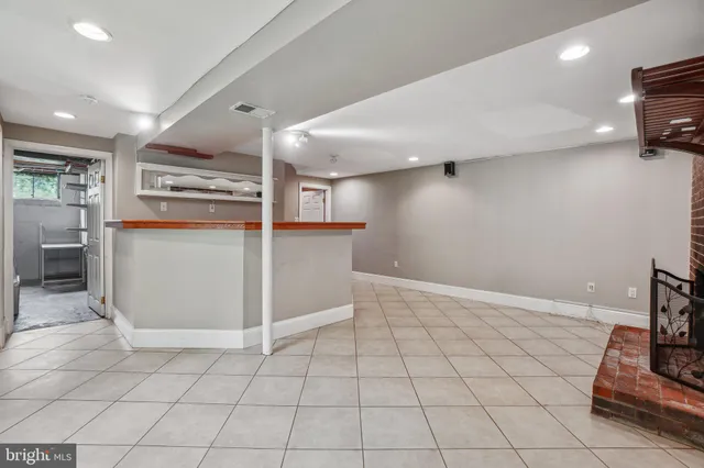 a kitchen with a sink and a stove top oven