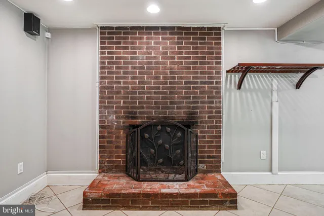 an empty room with closet and windows