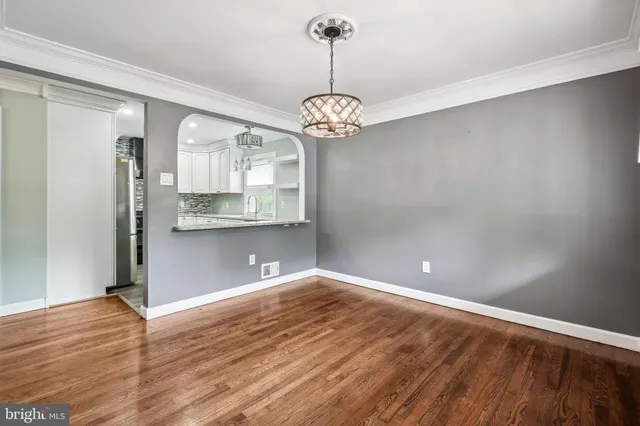 a view of a kitchen with a dishwasher cabinets and wooden floor