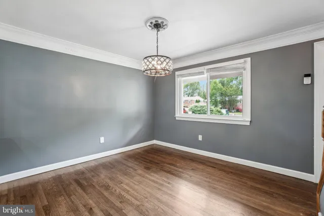 a view of a room with window wooden floor and windows