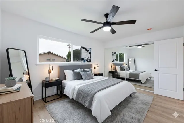 a bedroom with furniture and a window