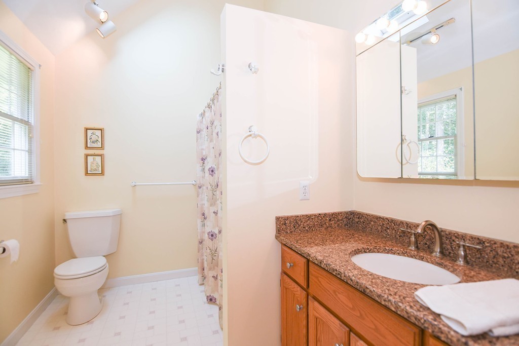 9 Nehemiah Road Shirley, MA 01464 - Photo 13 of 23 a bathroom with a granite countertop sink toilet and shower