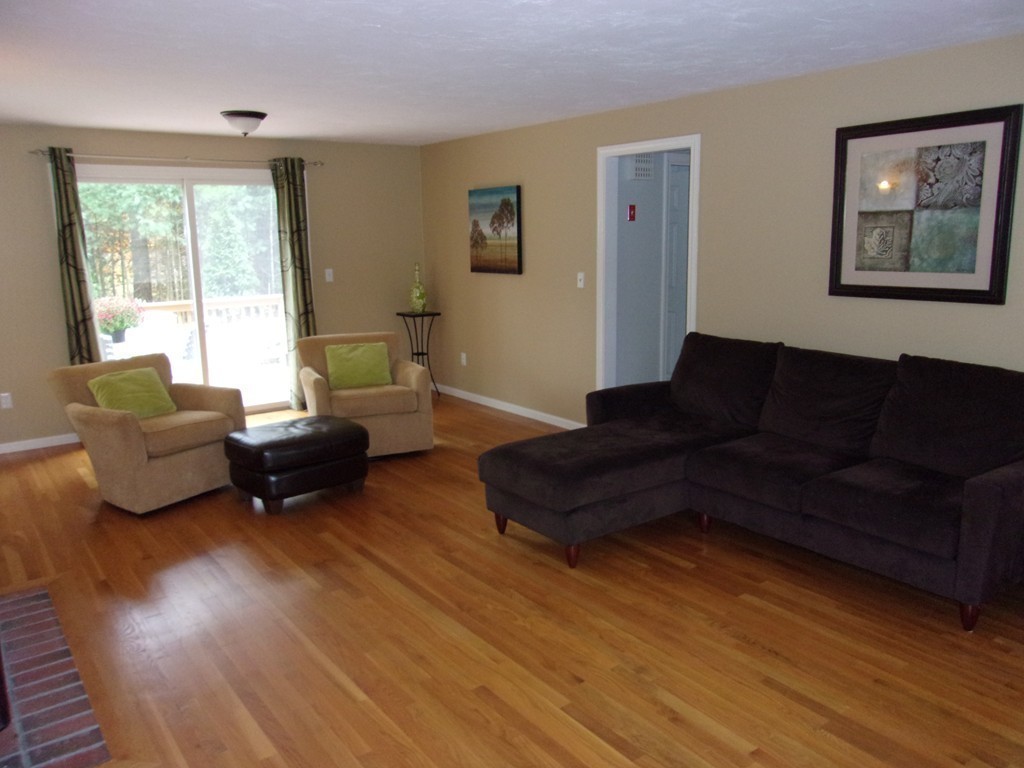 9 Nehemiah Road Shirley, MA 01464 - Photo 7 of 23 a living room with furniture wooden floor and a large window