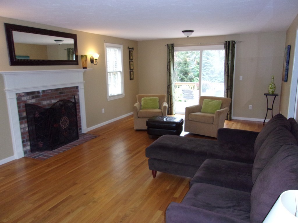 9 Nehemiah Road Shirley, MA 01464 - Photo 8 of 23 a living room with furniture and a fireplace