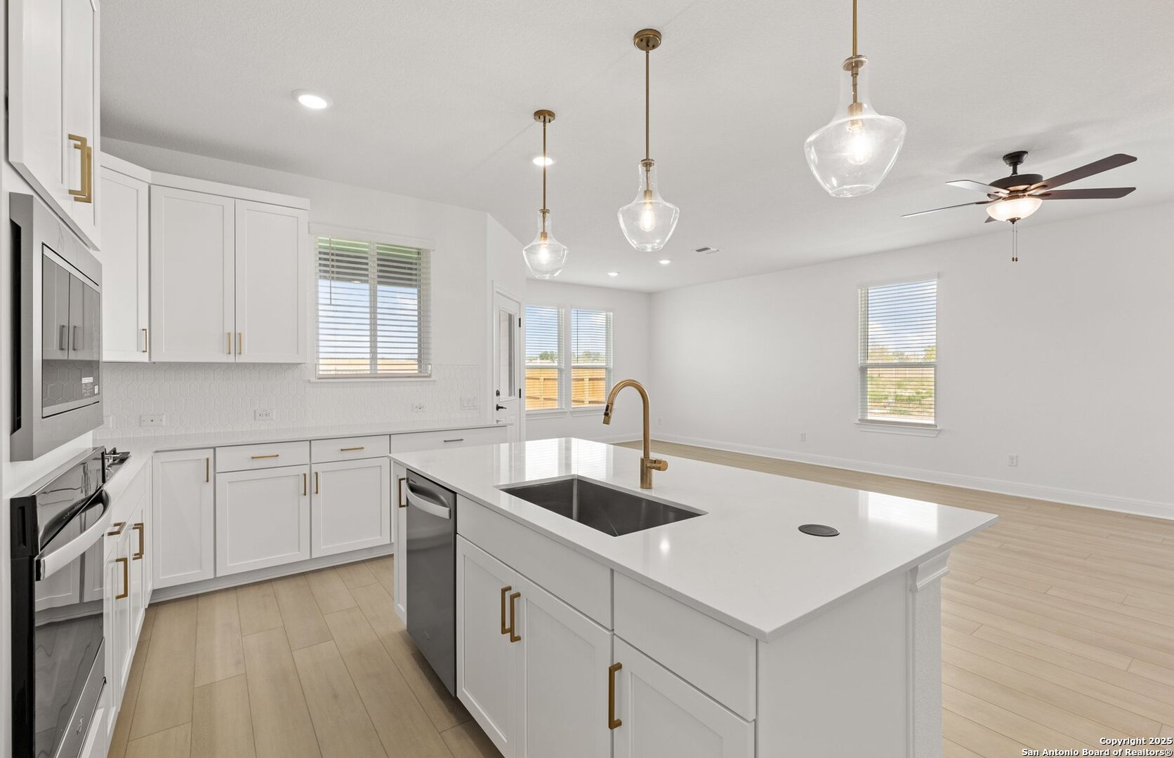 438 Nightingale Avenue Marion, TX 78124 - Photo 11 of 32 a kitchen that has a sink a stove and chairs