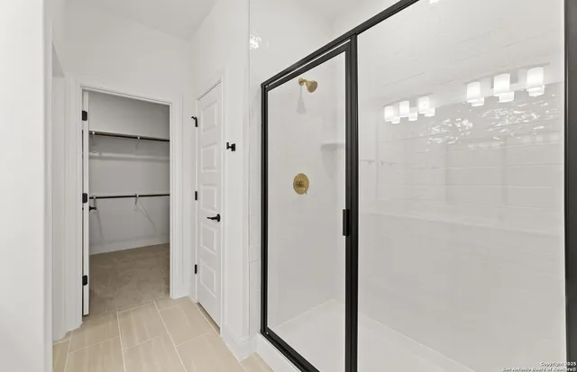 a view of a bathroom from a hallway