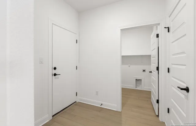 a view of a bathroom with wooden floor