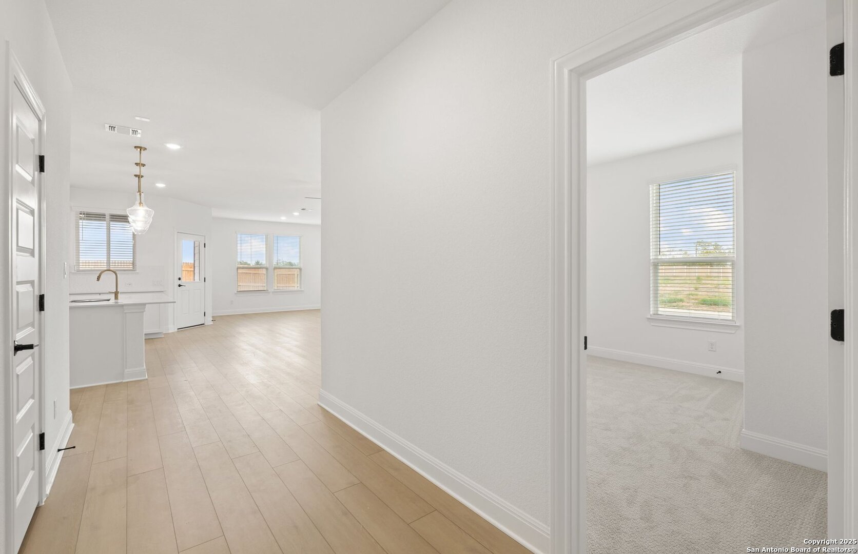 438 Nightingale Avenue Marion, TX 78124 - Photo 4 of 32 an empty room with wooden floor and windows