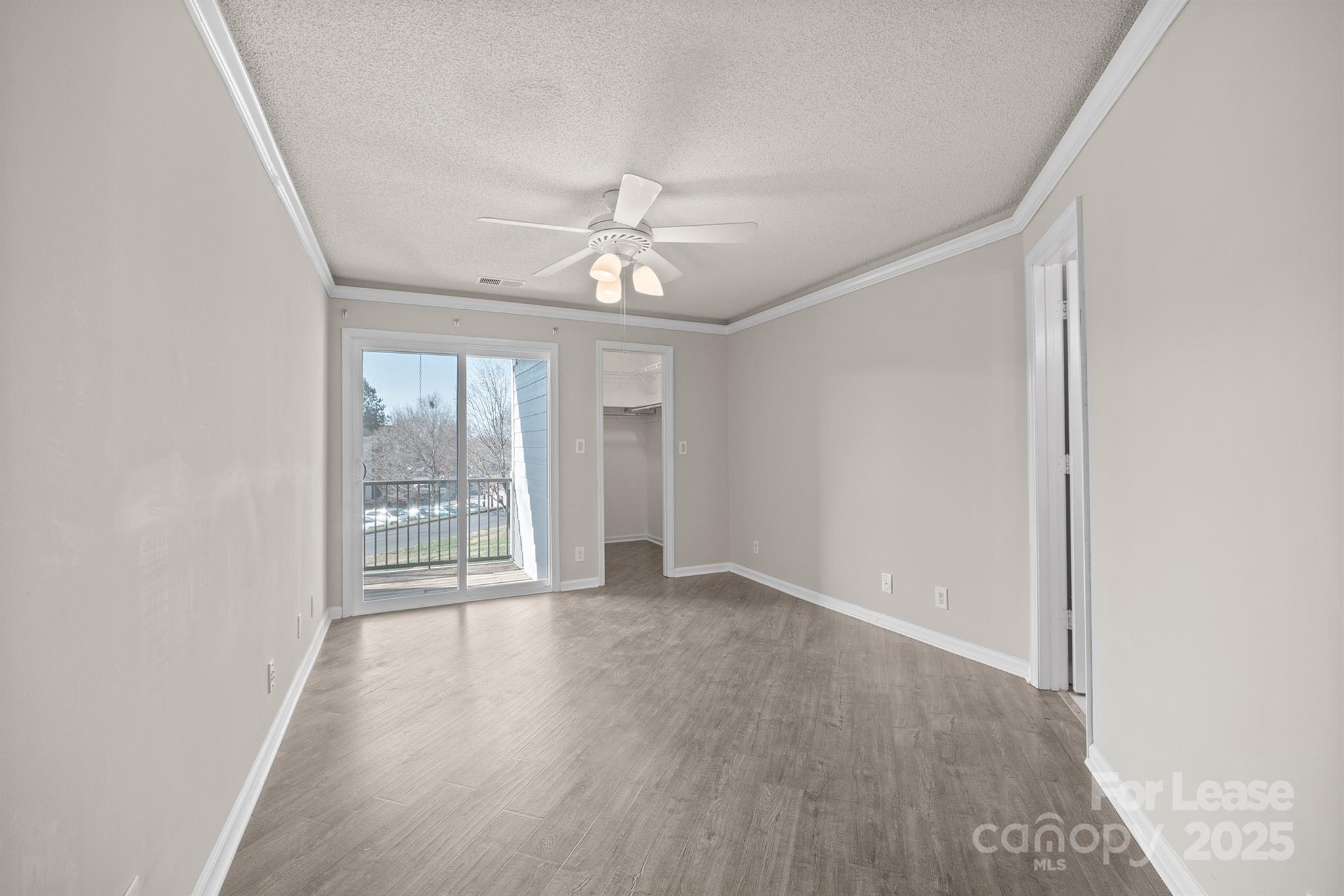 18809 Nautical Drive, Unit 202 Cornelius, NC 28031 - Photo 16 of 32 wooden floor in an empty room with a window