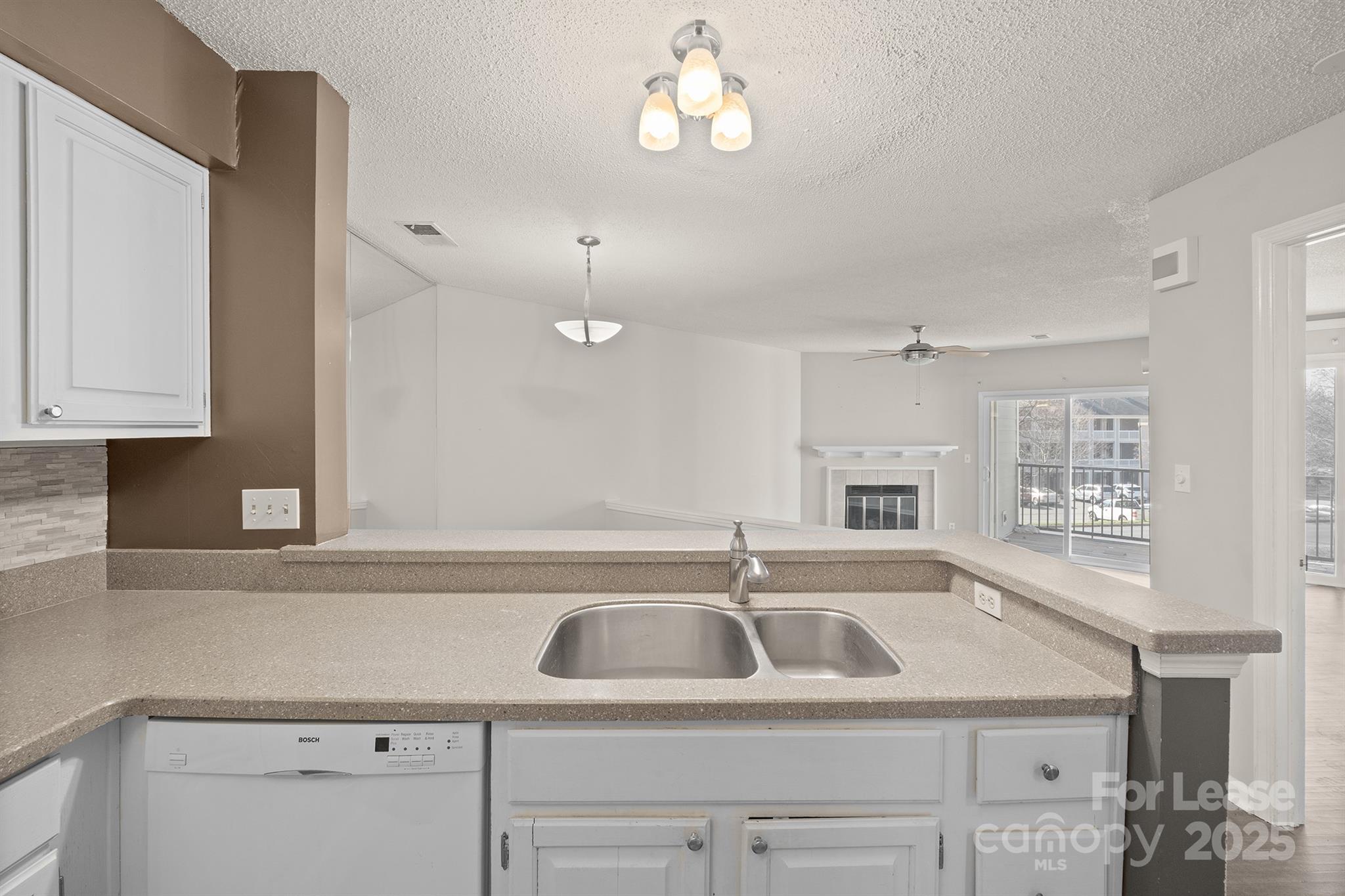 18809 Nautical Drive, Unit 202 Cornelius, NC 28031 - Photo 24 of 32 a view with a sink and chandelier