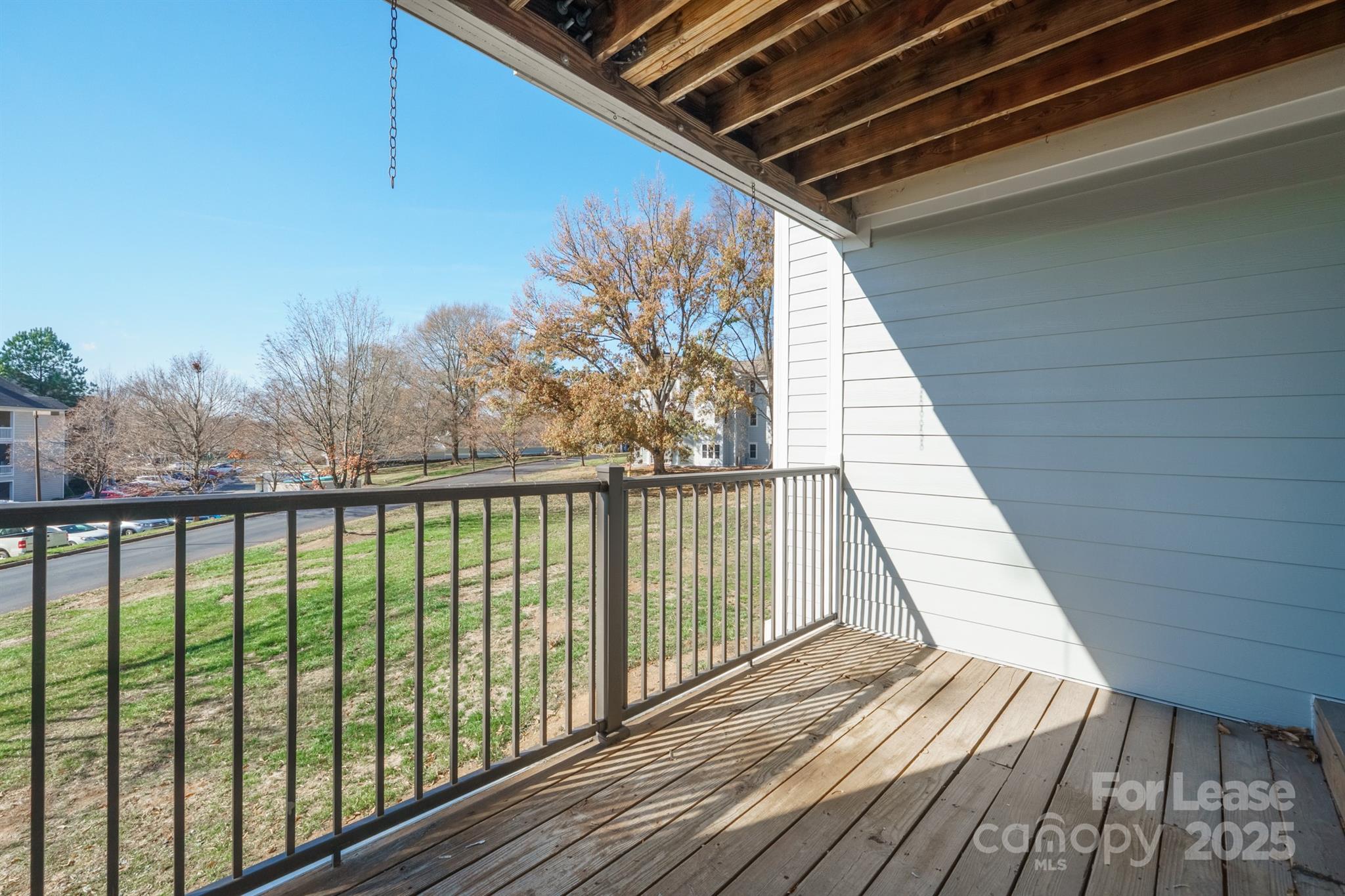 18809 Nautical Drive, Unit 202 Cornelius, NC 28031 - Photo 3 of 32 a view of balcony with wooden floor