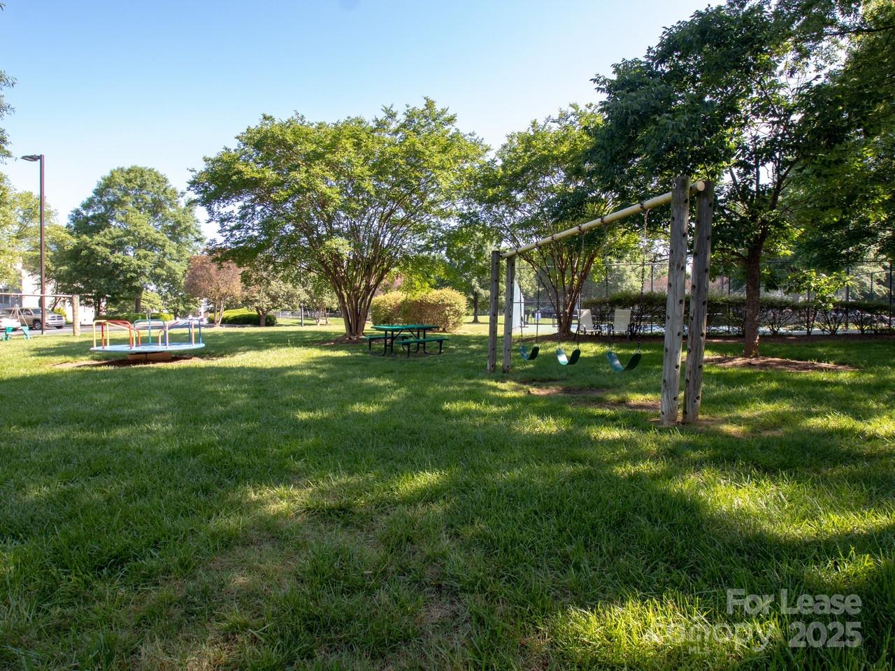 18809 Nautical Drive, Unit 202 Cornelius, NC 28031 - Photo 10 of 32 a view of a park with large trees