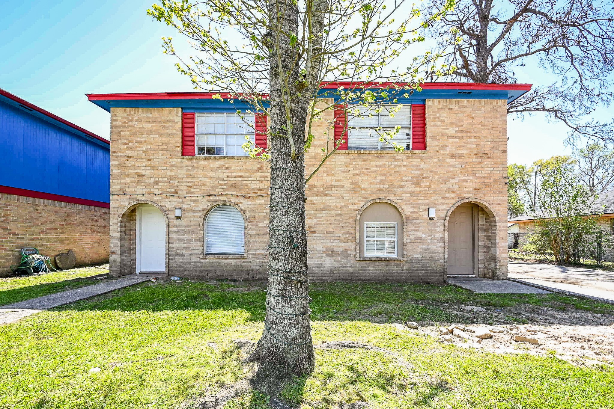 a view of house with yard