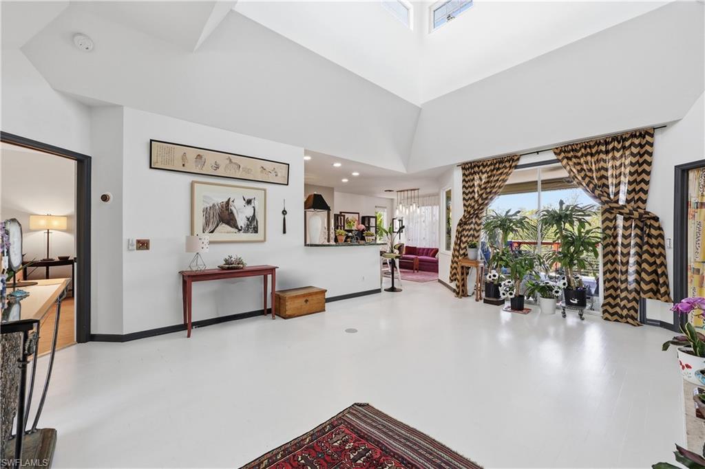 2958 Poplar Street Naples, FL 34112 - Photo 2 of 49 a view of a livingroom with furniture and a flat screen tv