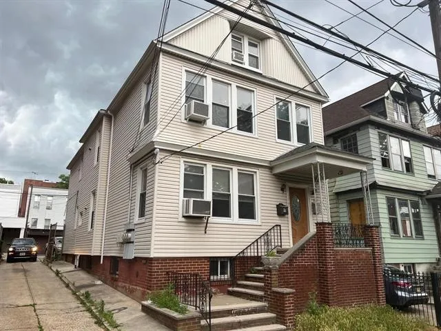 a front view of a house with a balcony