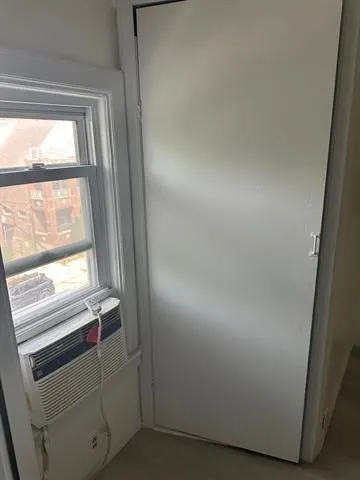 a view of an empty room and window