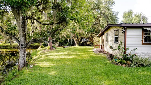a view of a house with a yard