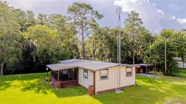 a view of a house with a yard balcony