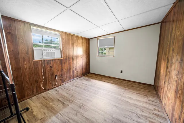 a view of an empty room with a window