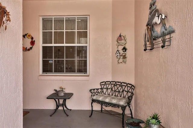 a wooden bench sitting in front of a door