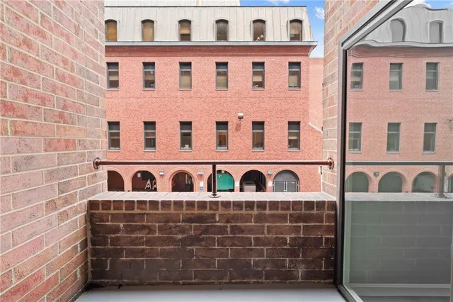 a kitchen with granite countertop a sink and cabinets
