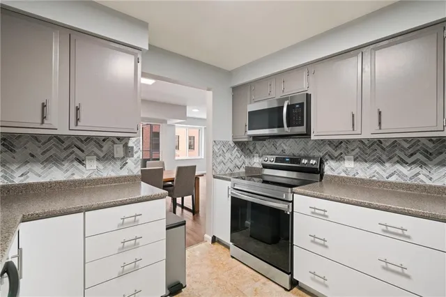 a kitchen with a stove microwave and refrigerator