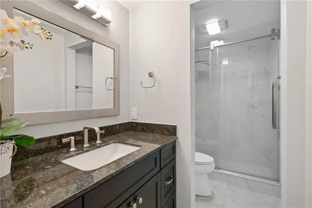 a bathroom with a shower and toilet