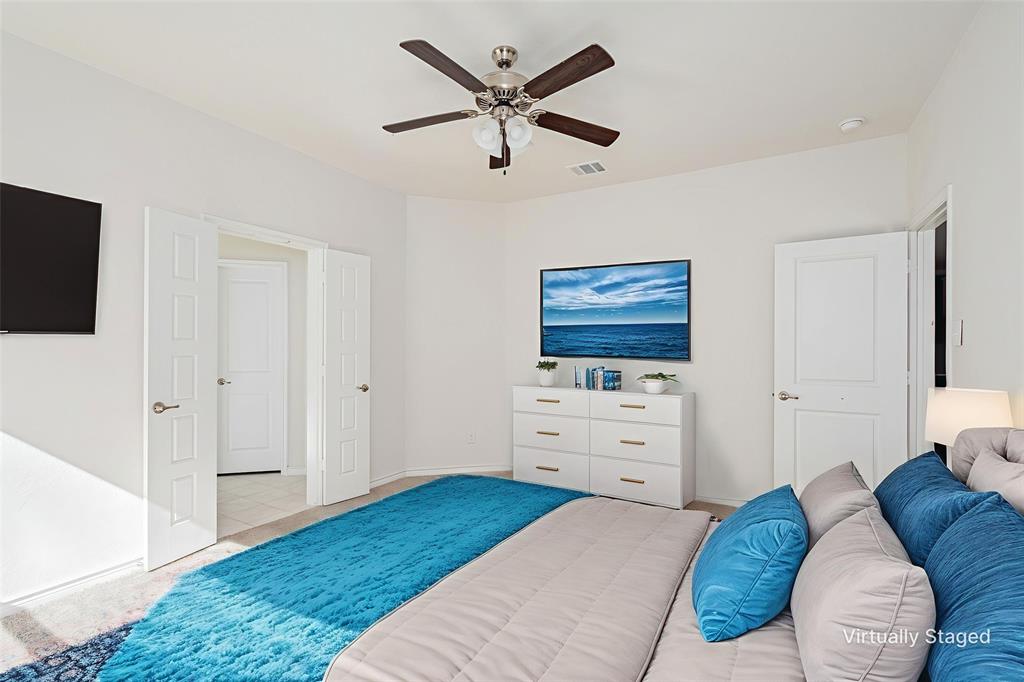 1500 Elizabeth Street Anna, TX 75409 - Photo 9 of 25 a bedroom with a bed and a flat screen tv
