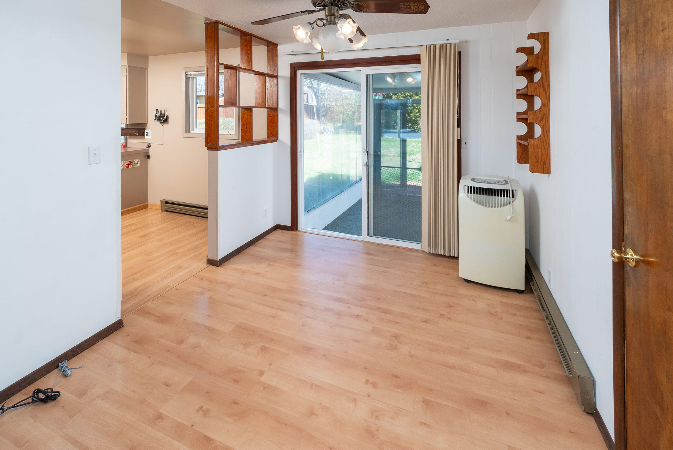2188 Northeast Shepard Road Bend, OR 97701 - Photo 21 of 52 Dining area with direct access to back enclosed covered patio and exterior deck. Sunny morning coffee, or shady evening entertaining.