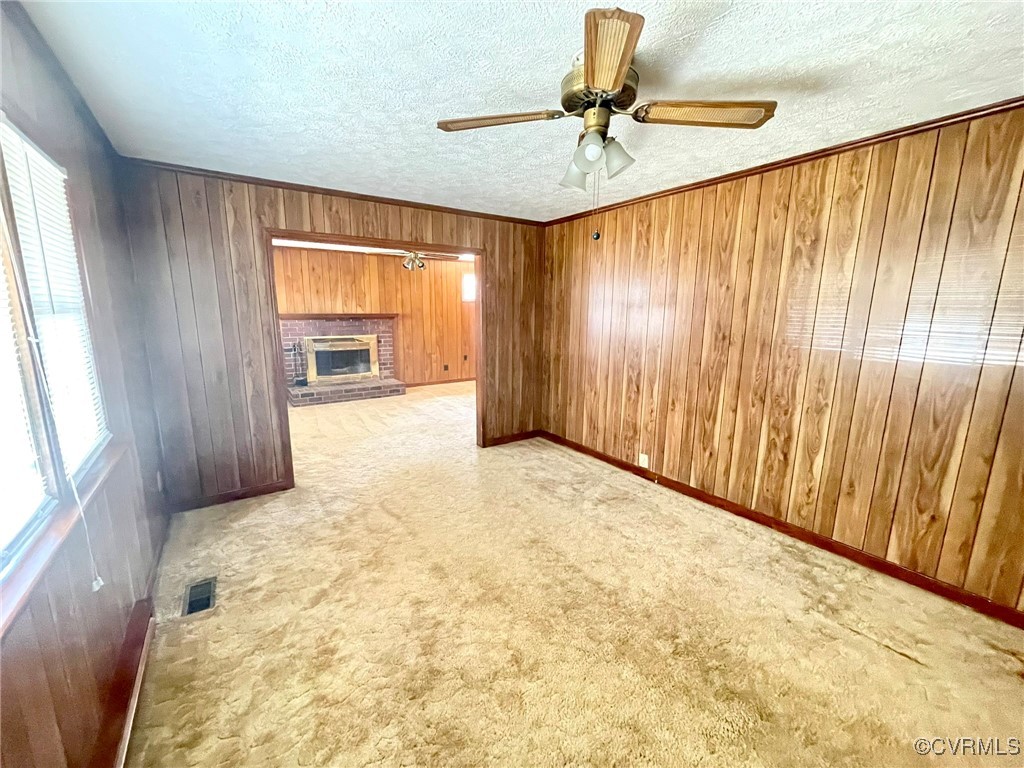 2930 Delfin Road Midlothian, VA 23112 - Photo 7 of 17 Carpeted living room and ceiling fan.