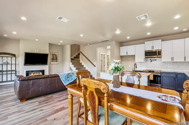 a view of kitchen with stainless steel appliances granite countertop lots of counter top space