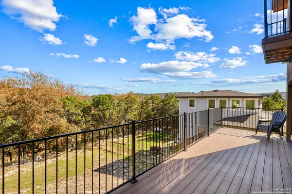 a view of a balcony with wooden floor